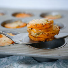 Scalloped Sweet Potato Stacks on a serving utensil