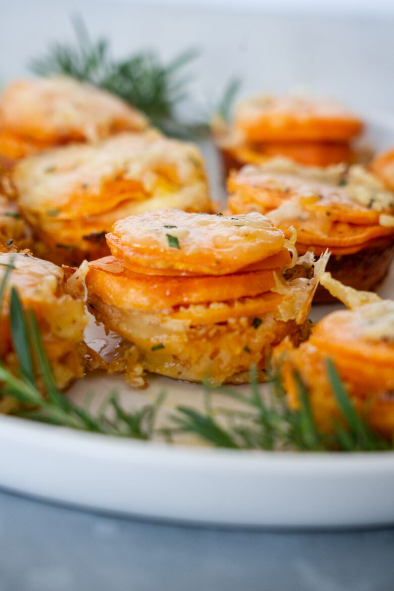 Scalloped Sweet Potato Stacks on a white serving plate.