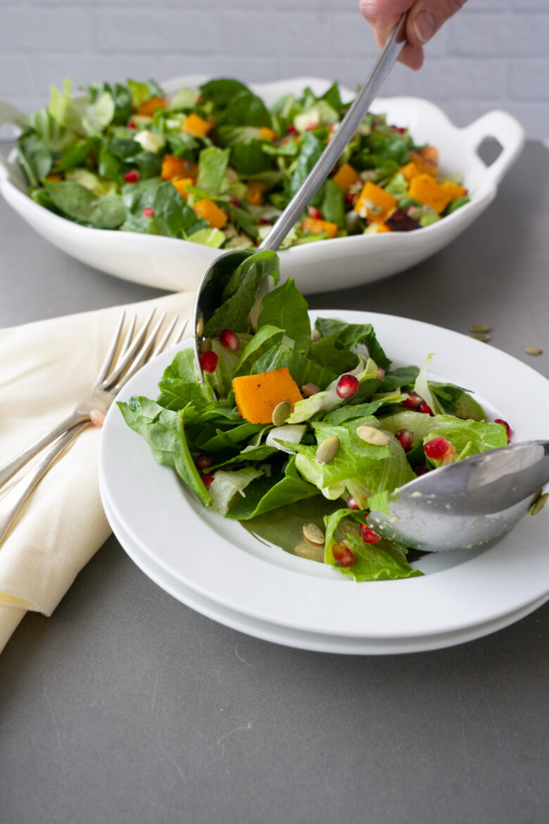 Harvest Salad with Buttermilk Sage Dressing being plated