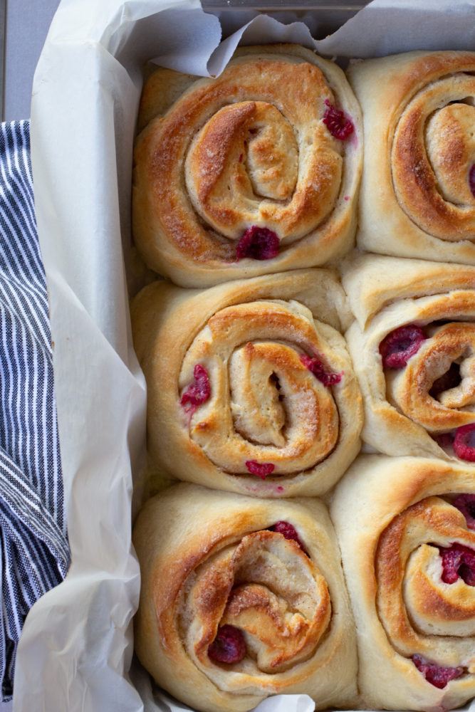 unfrosted cinnamon rolls with fresh raspberry filling