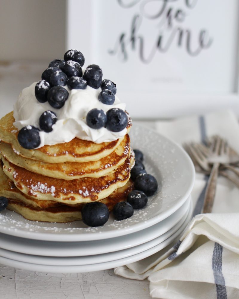 Buttermilk Pancakes with whipped cream and fresh berries