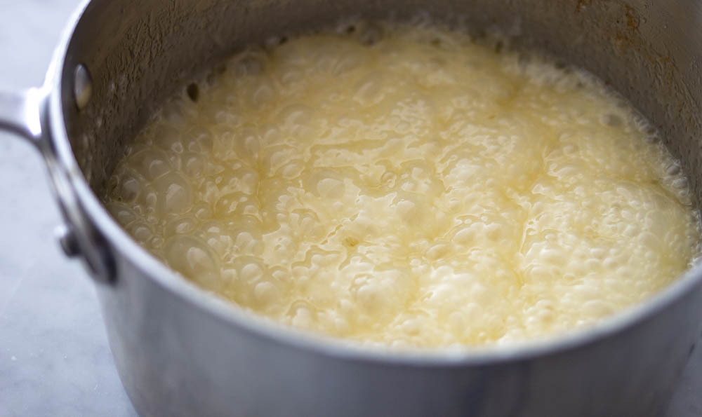 Cooking the butter and sugar for Golden Graham and Chex treat