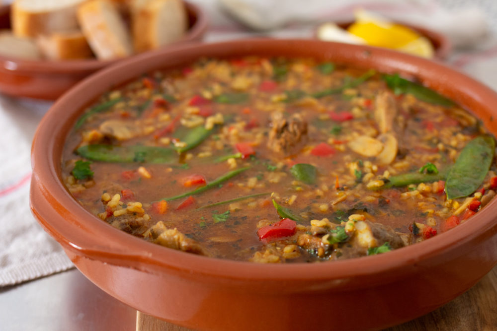 Spanish soup served with bread and lemon 