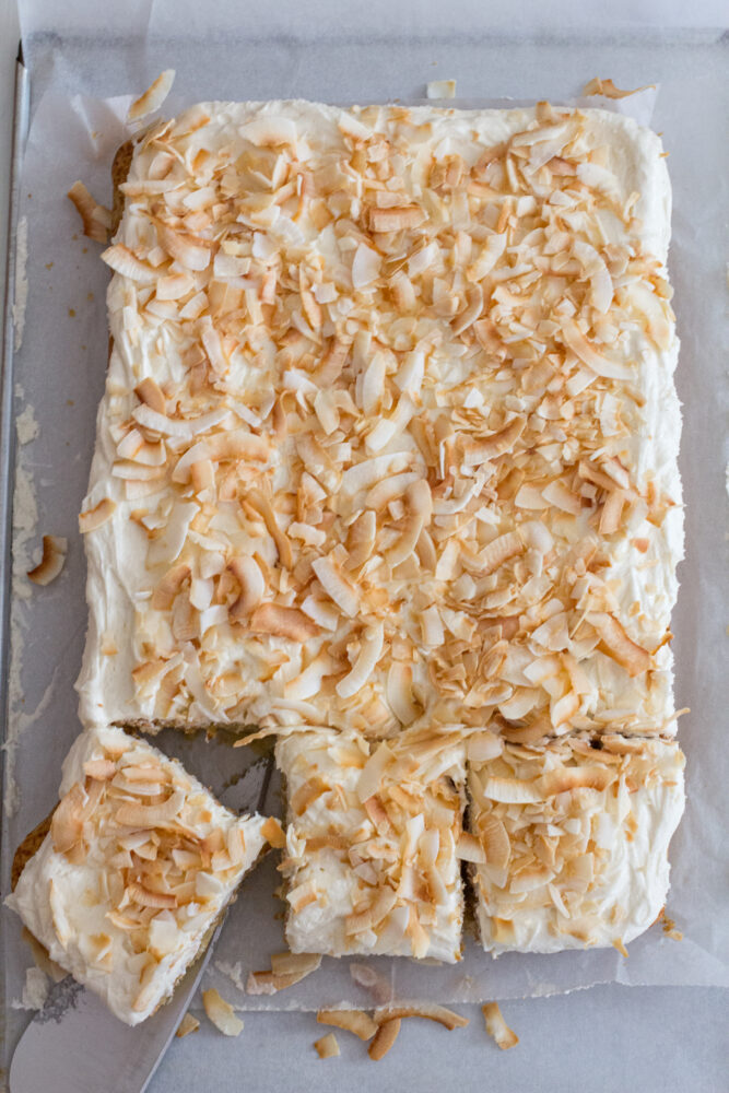 Moist and Easy Coconut Cake baked in 9x13 pan with Cream Cheese Frosting