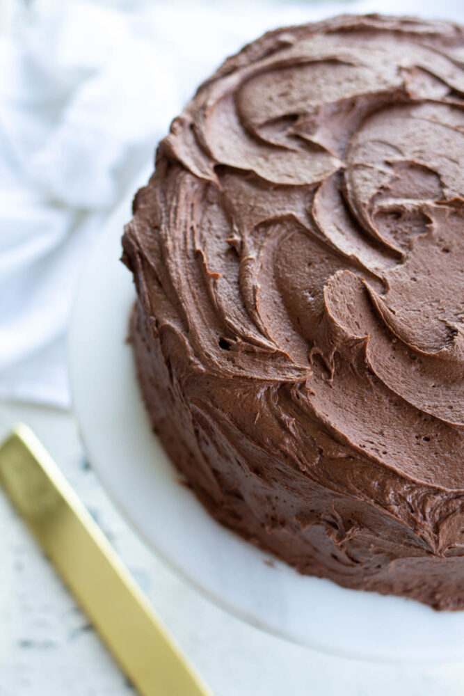 chocolate buttercream frosting on yellow cake