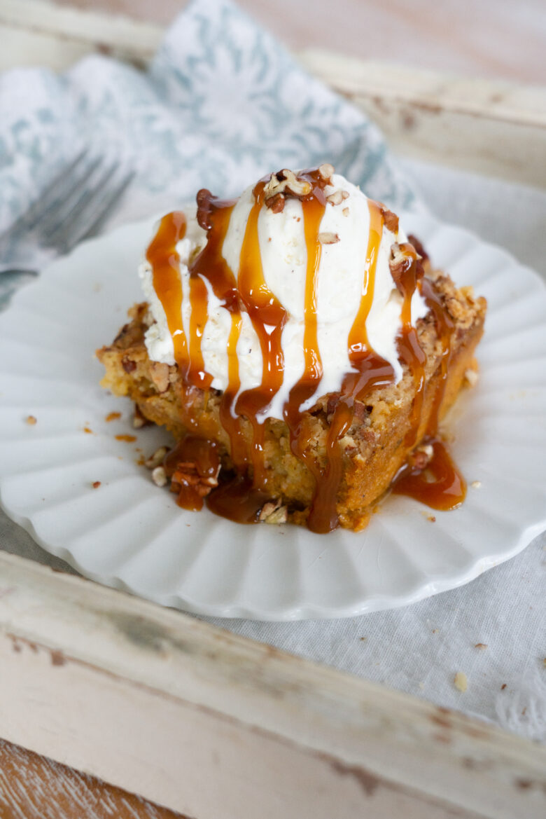 Pumpkin Dump Cake with vanilla ice cream and caramel topping 