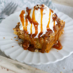 Pumpkin Dump Cake with vanilla ice cream and caramel topping