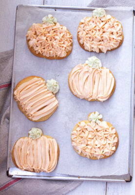 Our Favorite Sugar Cookies - pumpki shaped frosted cookies